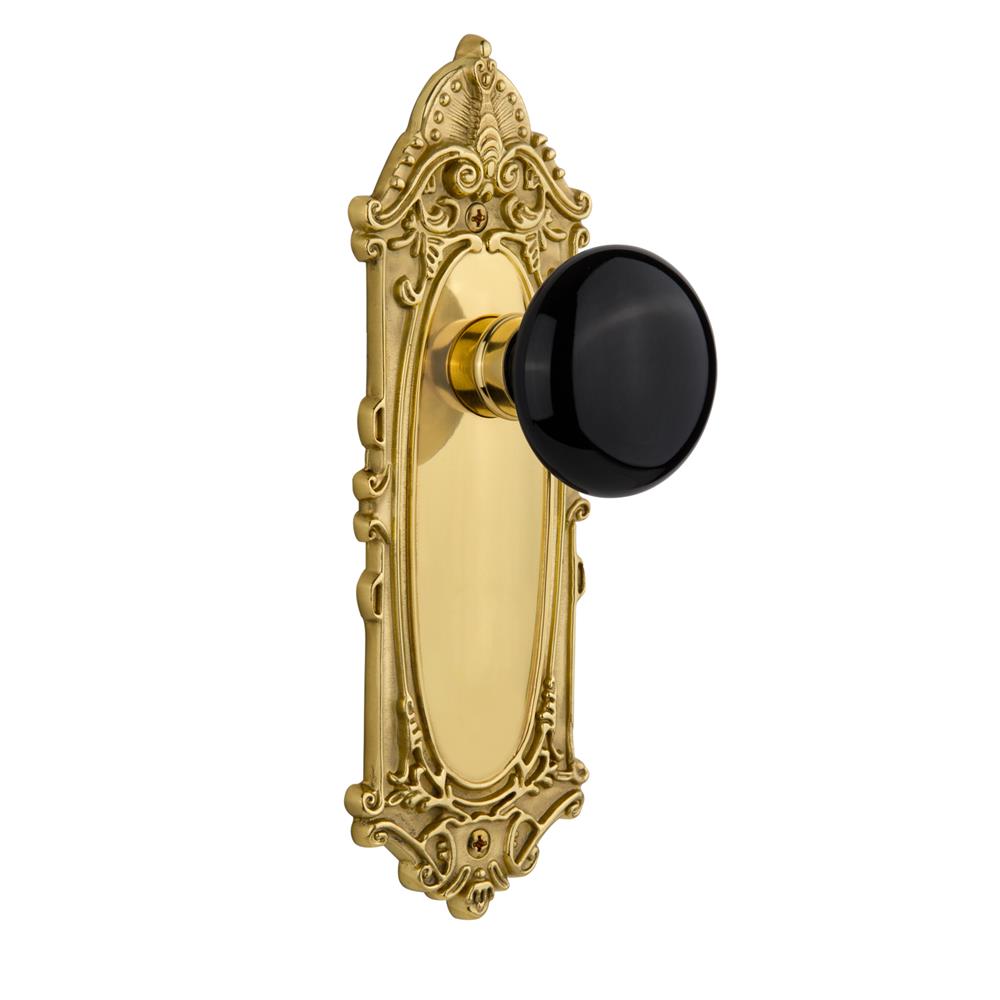 Nostalgic Warehouse VICBLK Single Dummy Knob Victorian Plate with Black Porcelain Knob in Unlacquered Brass